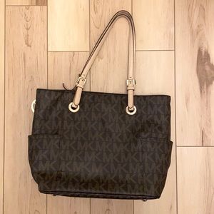 Michael Kors Purse with middle section laptop holder. Brown.